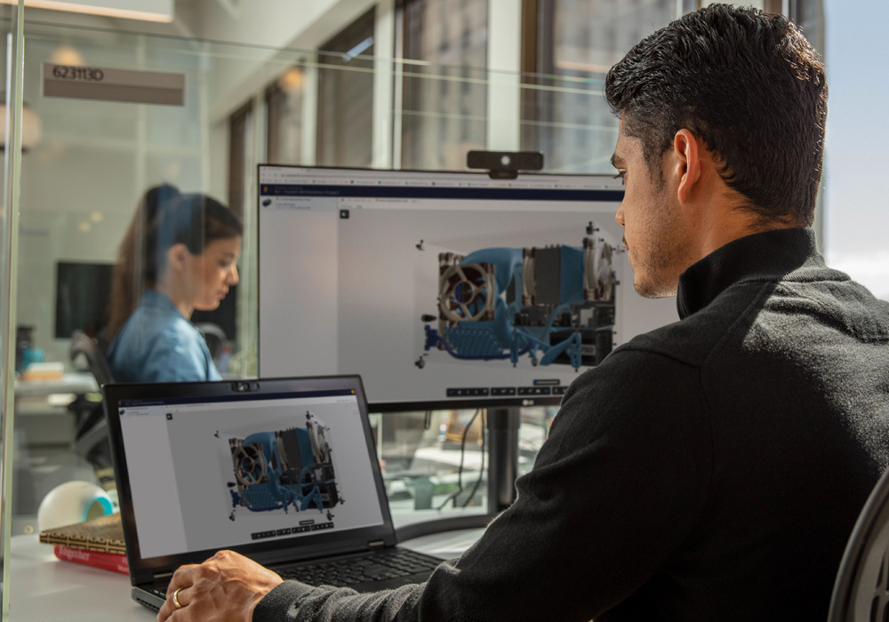 Man working with Fusion 360 in an office